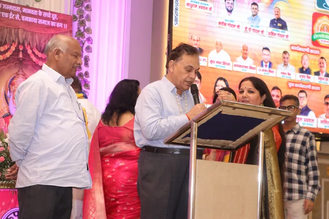 A speaker addressing the community during the celebration, photo 66, 17 October 2026