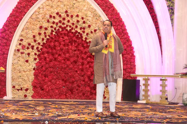 A speaker addressing the community during the celebration, photo 67, 17 October 2026